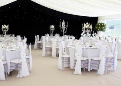 Marquees.Com | Temporary warehouse and long term marquee hire Cheshire and North West | Wedding marquee white table dressing