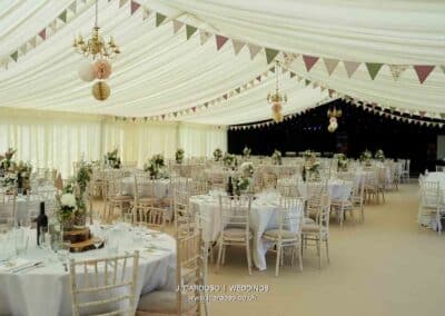 Marquees.Com | Temporary warehouse and long term marquee hire Cheshire and North West | Wedding marquee interior with bunting