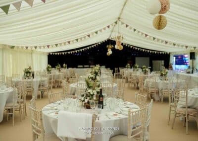 Marquees.Com | Temporary warehouse and long term marquee hire Cheshire and North West | Wedding marquee round tables
