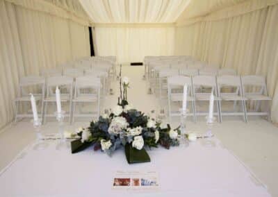 Marquees.Com | Modular and Clearspan Marquee Hire Cheshire and North West | Flower installation and folding chairs